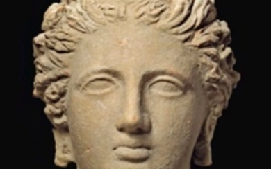 A GREEK TERRACOTTA VOTIVE FEMALE HEAD, TARAS, HELLENISTIC PERIOD, CIRCA 4TH-3RD CENTURY B.C.