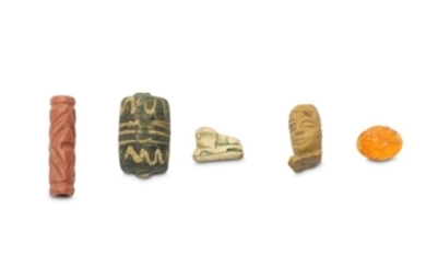 A GROUP OF NEAR EASTERN AMULETS AND SEALS...