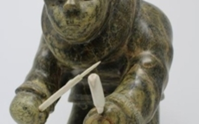 Large Carved Hunter w/ Bone Club Inuit Sculpture