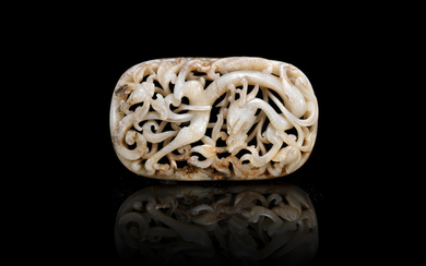 A mottled black and white jade reticulated 'dragon' plaque