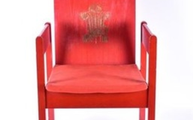 A red painted beech Prince of Wales investiture chair designed by Lord Sowden for 'Remploy', made with beech and plywood,...