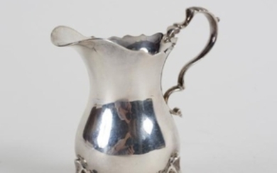 A silver helmet-shaped cream jug, JBC & Son Ltd.
