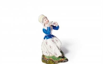 A small Höchst porcelain figure of a lady dri ...