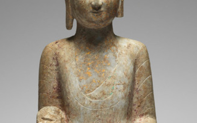 A very rare limestone bust of the Buddha