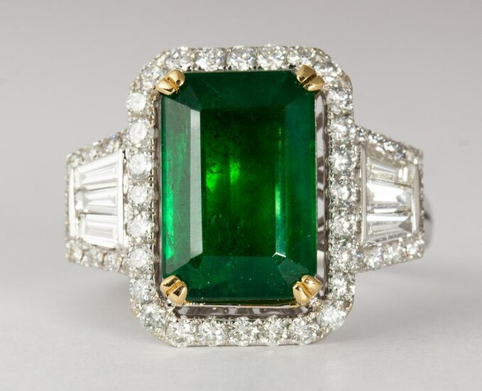 Emerald, diamond and 18k white gold ring