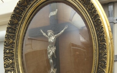 A 19TH CENTURY GILT FRAMED SILVERED BRONZE CRUCIFIX WITH DOME GLASS