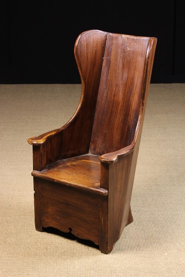 A 19th Century Child's Painted Pine Enclosed Armchair/Lambing Chair with wood-grained finish. The ch