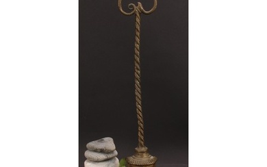 A 19th century brass and cast iron bell shaped door stop or ...