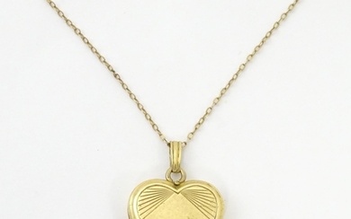 A 9ct gold pendant locked of heart shape, together with a 9c...
