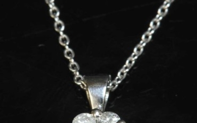 A 9ct white gold diamond set cluster pendant