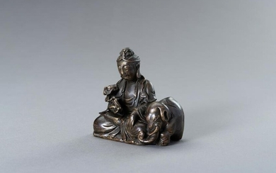 A BRONZE FIGURE OF GUANYIN WITH ELEPHANT