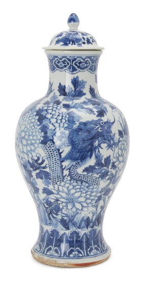 A Chinese blue and white dragon vase, 18th/19th century, painted with two dragons amongst peonies, associated cover, 38cm high 十八-十九世紀 青花繪雙龍穿牡丹紋瓶連蓋