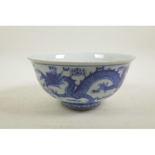 A Chinese blue and white porcelain bowl decorated with two d...