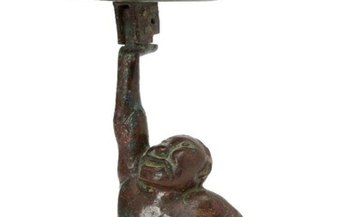 A Chinese bronze figural candleholder, Western Han dynasty, cast as...