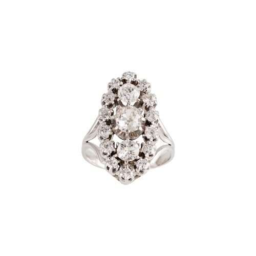 A DIAMOND CLUSTER RING, of navette form, set with old cut di...