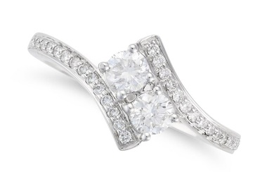 A DIAMOND CROSSOVER RING in platinum, set with two round brilliant cut diamonds accented by round
