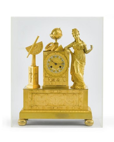 A French Charles X gilt-bronze figural clock