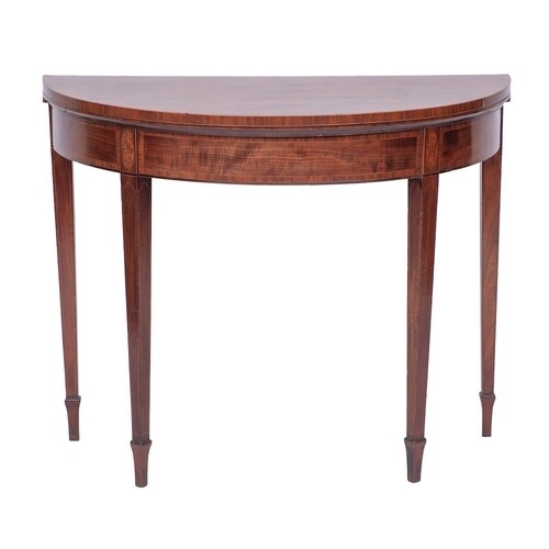 A George III mahogany and crossbanded demi-lune card table i...