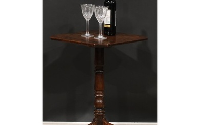 A George III mahogany tripod wine table, canted square top i...