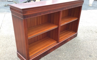 A Georgian style mahogany open bookcase with moulded ribbed cornice...