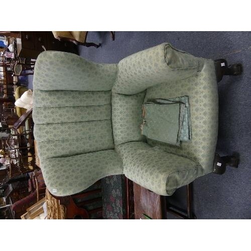 A Georgian style wing back Armchair, with sectional upholste...