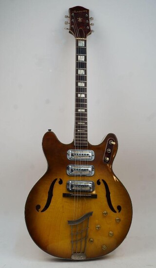 A Harmony model H-75 hollow body electric guitar, circa 1960's, two-tone yellow burst finish, rosewood fretboard, serial no. 2202, bearing label to interior for THE Harmony COMPANY - MADE IN CHICAGO IL., USA, in associated case CITES Appendix II...