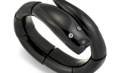 A JET SNAKE BRACELET, the large curved tapered round