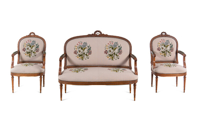 A Louis XVI Carved Walnut Seating Suite with Petit Point Upholstery