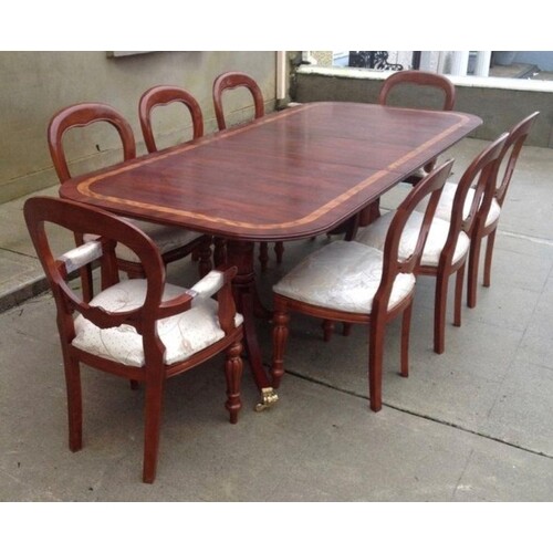A MAHOGANY EXTENDABLE DINING TABLE, with crossbanding to top...