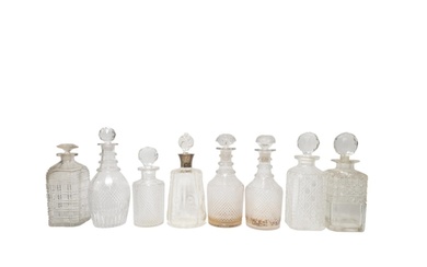A MIXED GROUP OF EIGHT 19TH CENTURY CUT GLASS DECANTERS, the...