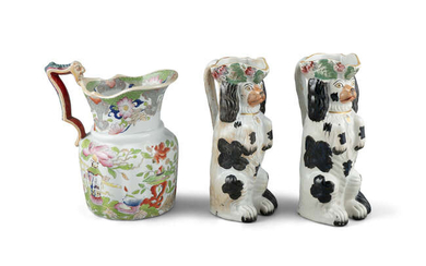 A PAIR OF 19TH CENTURY STAFFORDSHIRE JUGS, moulded...