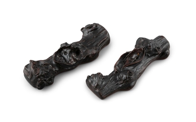 *§A PAIR OF ZITAN ‘BRANCH’ WRISTRESTS OR SCROLLWEIGHTS China, Late Qing to Republic / Minguo...
