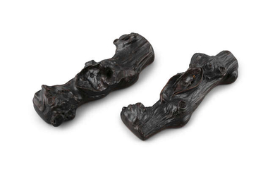 *§A PAIR OF ZITAN ‘BRANCH’ WRISTRESTS OR SCROLLWEIGHTS...
