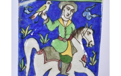 A PERSIAN ISLAMIC QAJAR HORSE AND RIDER TILE. 22 cm x 17 cm.