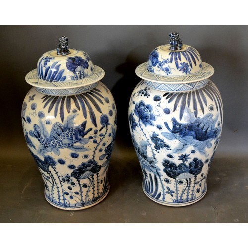 A Pair of Chinese Underglaze Blue Decorated Covered Vases, t...