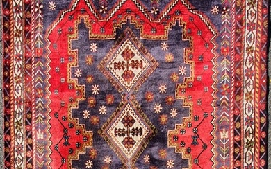 A RED AND BLUE WOOL CARPET