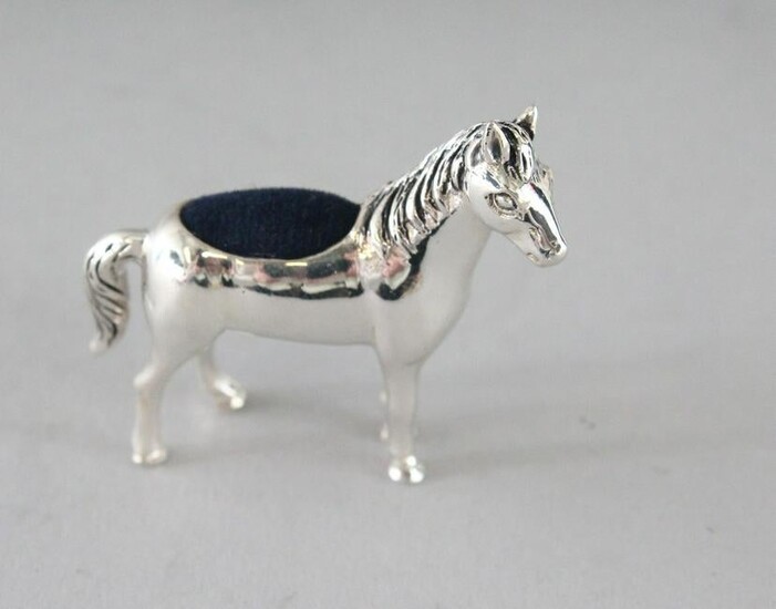 A SILVER HORSE PIN CUSHION. 1.5ins.