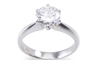A SOLITAIRE DIAMOND RING - The round brilliant cut diamond weighing 1.406cts, in platinum, ring size K with accompanying Auscert cer...