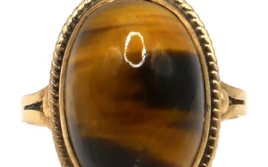 A SOUTH AFRICAN 9CT GOLD AND TIGERS EYE RING...