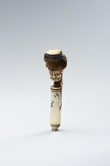 A STAG ANTLER CANE HANDLE OF AN ONI