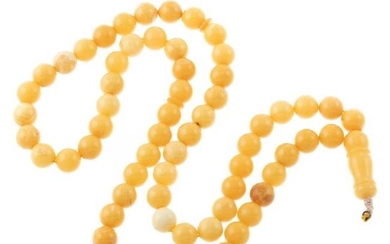 A Strand of 11.5 mm Butterscotch Amber Beads