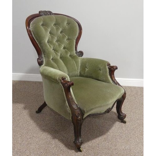 A Victorian walnut gentleman's Armchair, with leaf capped ca...