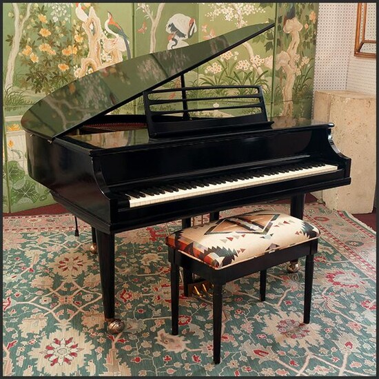 A W.M. Kimball Baby Grand Player Piano.