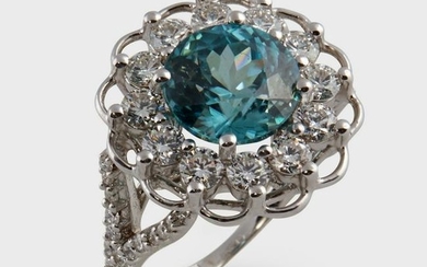 A blue zircon, diamond, and eighteen karat white gold