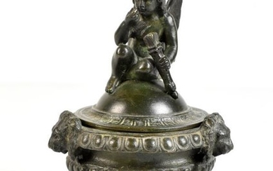 A bronze Renaissance style Grand Tour inkwell with cherubic...