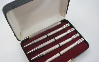 A cased set of 4 sterling silver bridge pencils, the clips m...