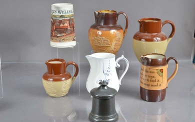 A collection of six various jugs including a Doulton Lambeth harvest jug