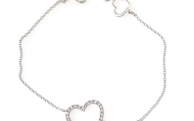 A diamond bracelet with a pendant in the shape of a heart...