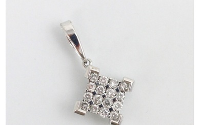 A diamond set 9ct white gold pendant, the square shaped pend...