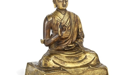 A fine and heavy Tibetan gilt bronze figure of a lama. 17th-18th century. Weight 5037 g. H. 21.5 cm.
